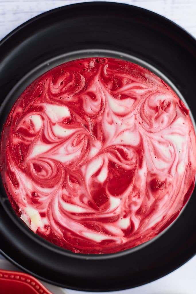 Overhead view of the red and white cheesecake.