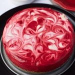 red velvet cheesecake on black plate