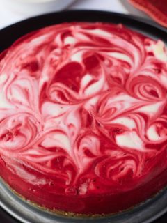 red velvet cheesecake on black plate