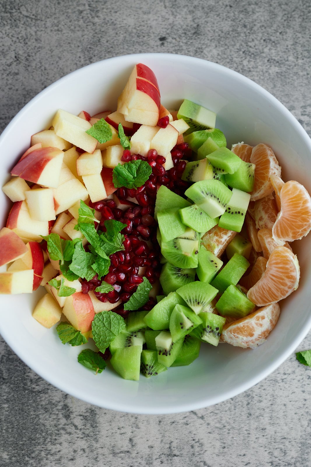 various fruits in white bowl in rows