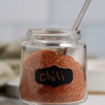 A labelled jar with chili powder substitute.
