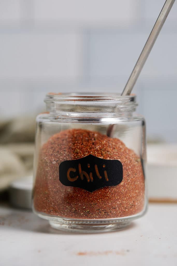 A labelled jar with chili powder substitute.