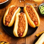 hot dogs covered in chili