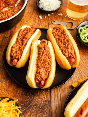 hot dogs covered in chili