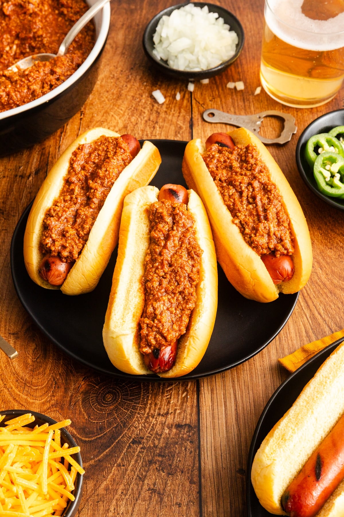 hot dogs covered in chili