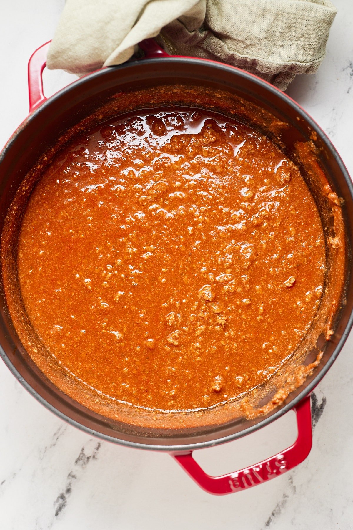 Hot dog chili in a red pot after simmering.