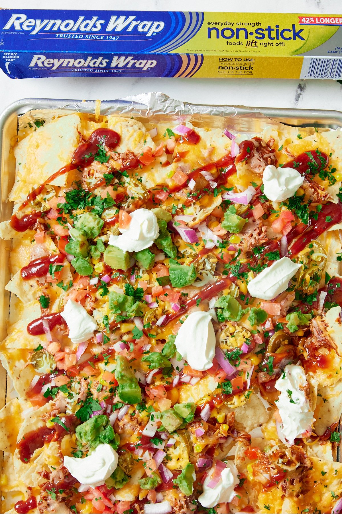 bbq nachos with Reynolds® Wrap Non-Stick Foil box at the top.