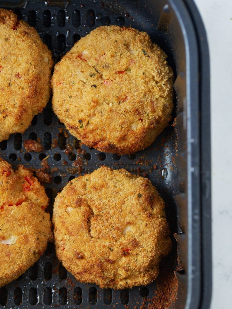 salmon patties cooked inside air fryer basket