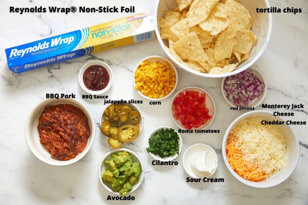 ingredients for bbq nachos on white background