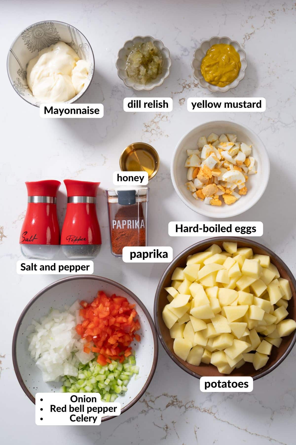 Ingredients for southern potato salad on countertop with labels