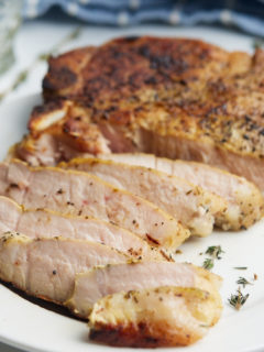 sous vide pork chops sliced on plate