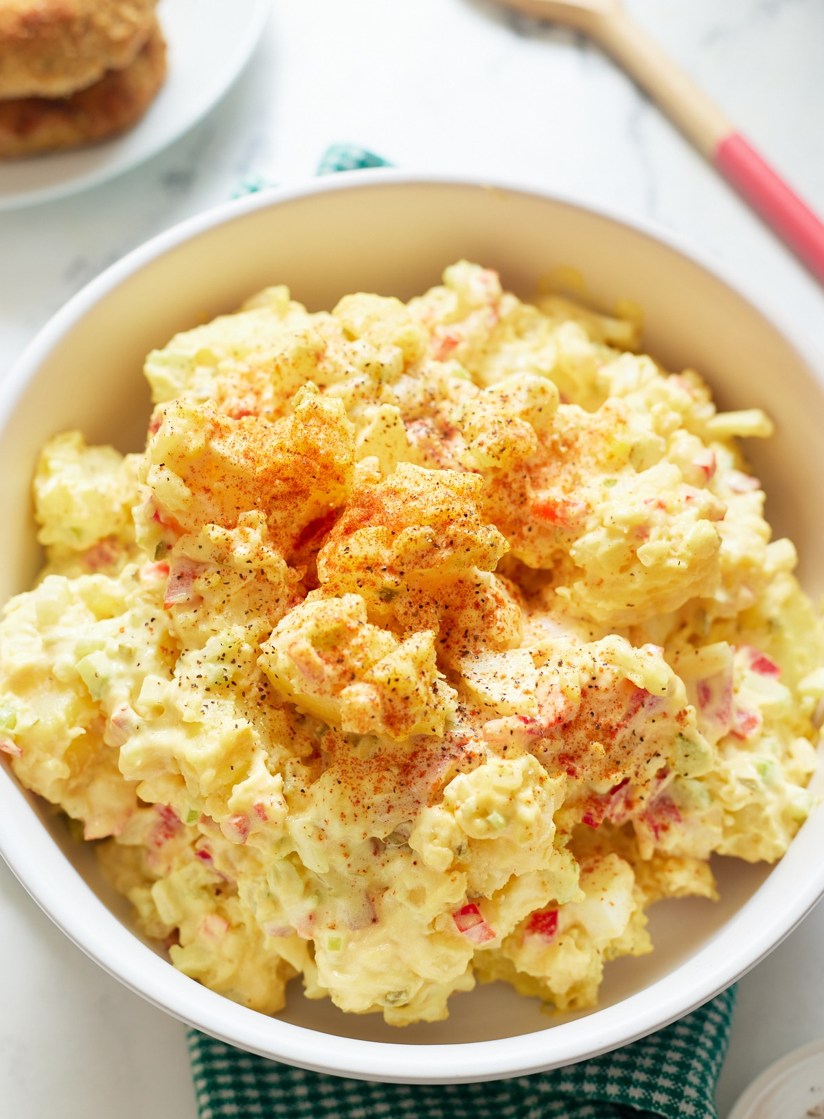 Overhead shot of the Southern potato salad in a white bowl.