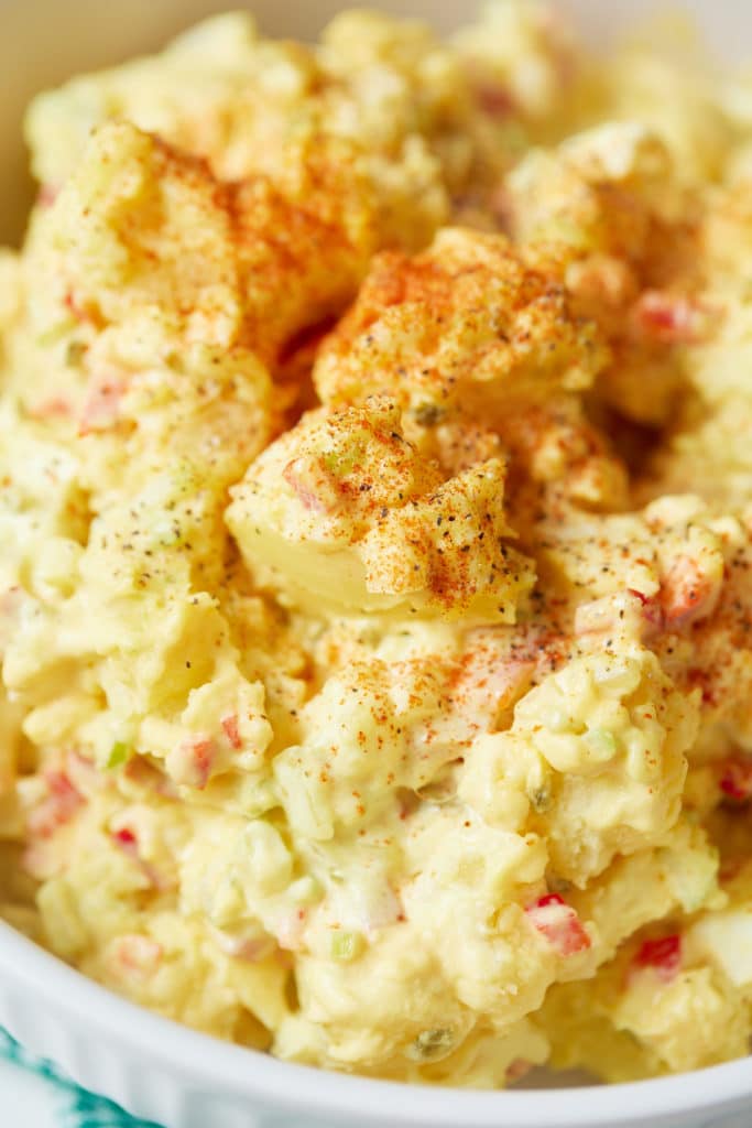 Close up of the potato salad garnished with paprika.