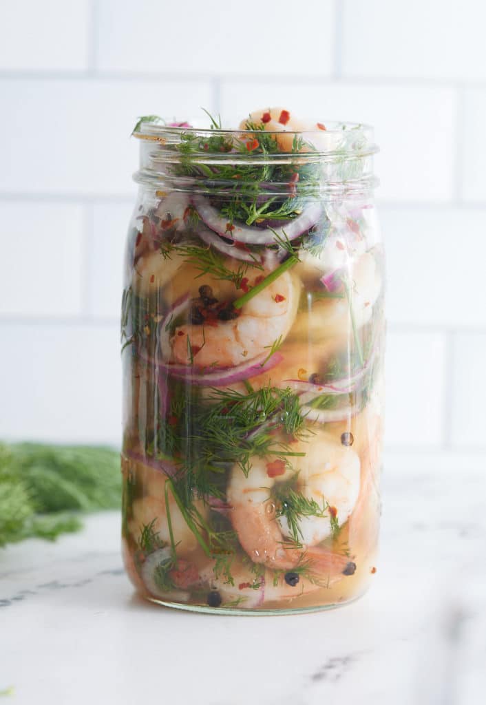 The shrimp and brine in a mason jar.