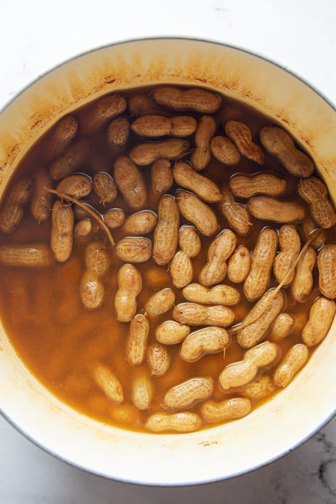 The cooked peanuts in a large pot.