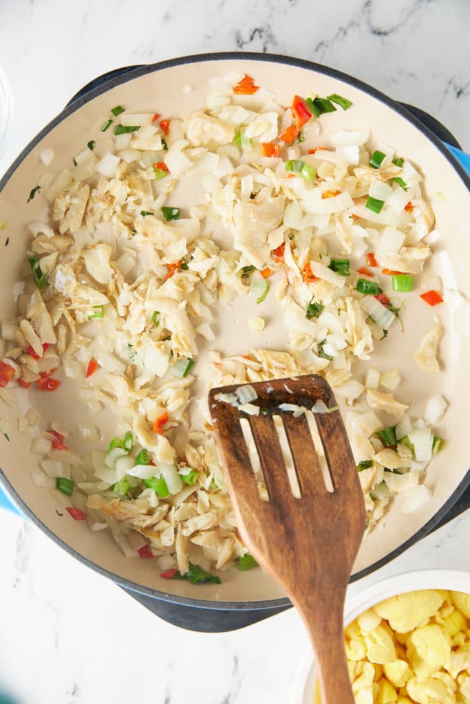 onions, peppers, and saltfish in skillet