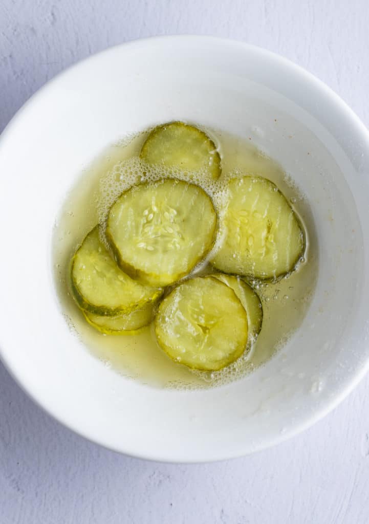 pickles being coated in egg whites.