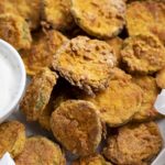 Close up of air fryer fried pickles in a serving bowl.
