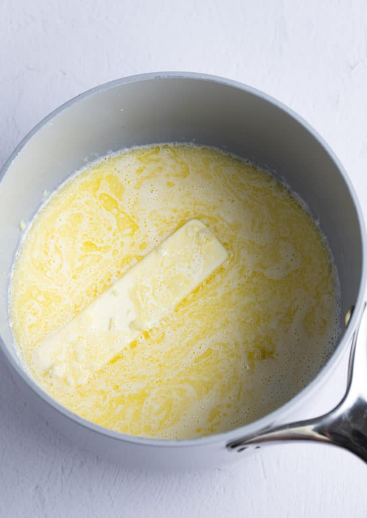 Butter and milk in a pot.