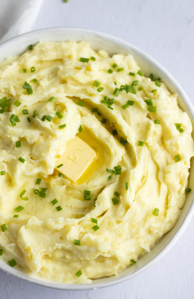 Mashed potatoes garnished with fresh chives.