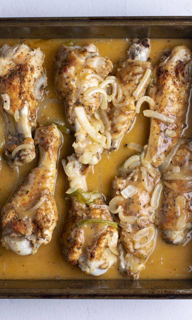 Gravy poured over the baked turkey wings.