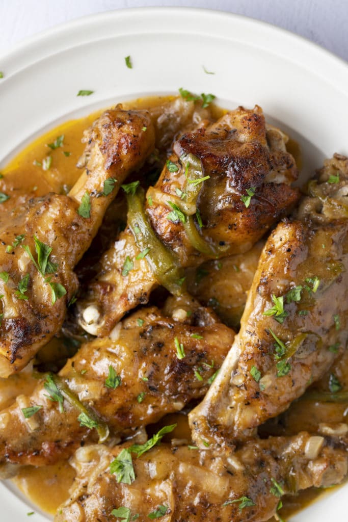 Cooked turey wings and gravy ready to serve.
