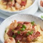 Tow bowls of Southern style shrimp and grits.