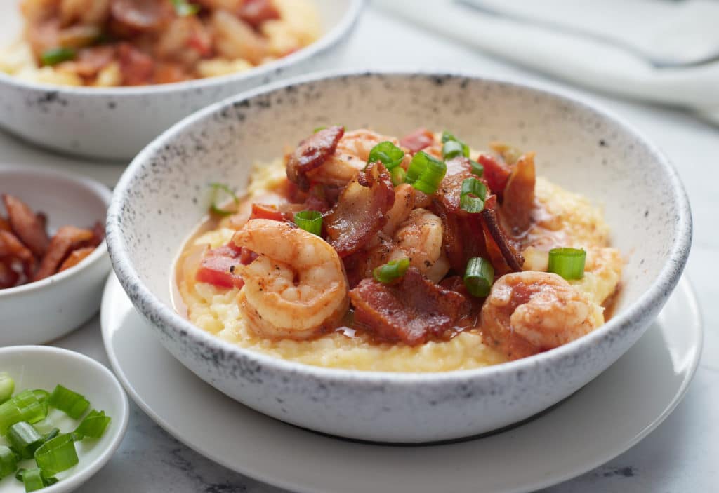 Southern style shrimp and grits served in a bowl.