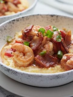 Southern style shrimp and grits served in a bowl.