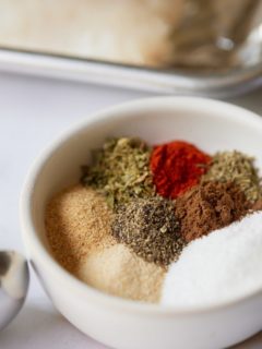 Close up of the seasonings in a small white bowl.