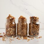 Three glass jars of air fryer granola.