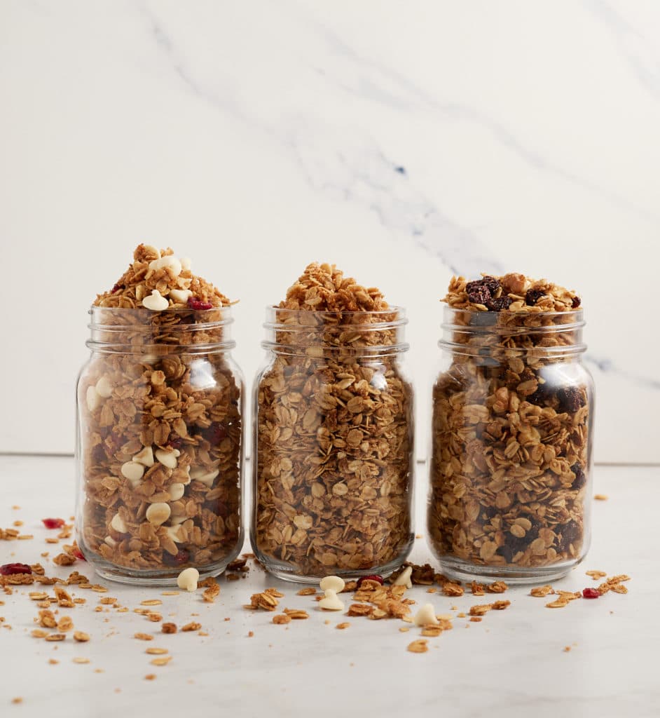 Three glass jars of air fryer granola.