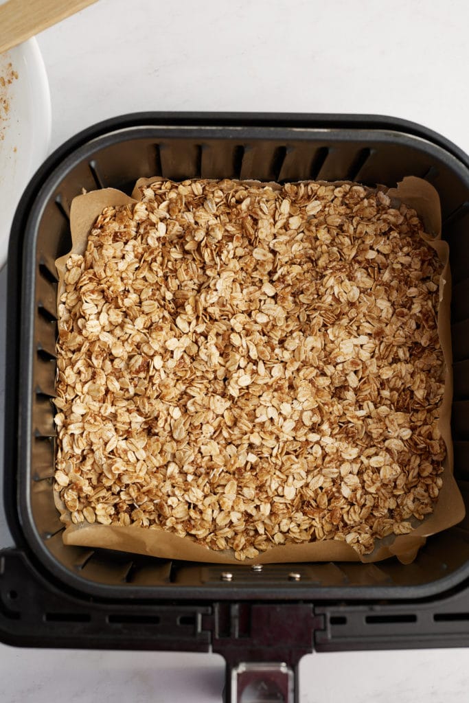 Granola placed in the air fryer basket.
