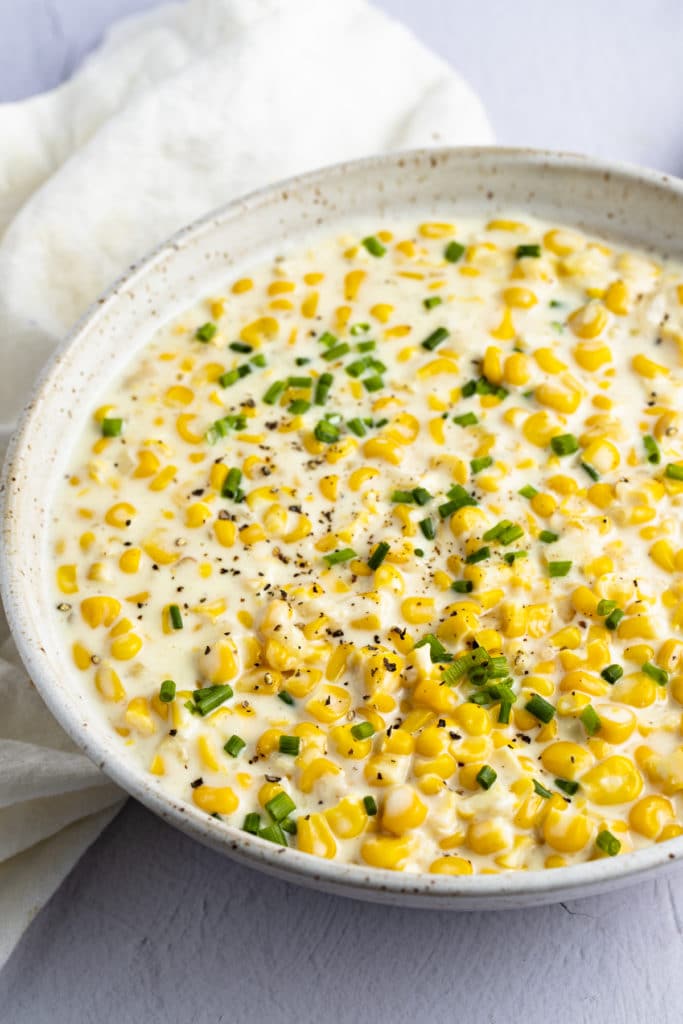 A skillet of creamed corn.