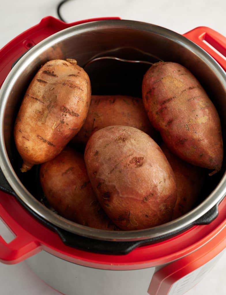 Sweet potatoes and water in an Instant Pot.