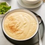 cornmeal porridge in bowl with spoon on side