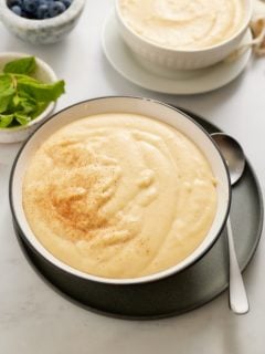 cornmeal porridge in bowl with spoon on side