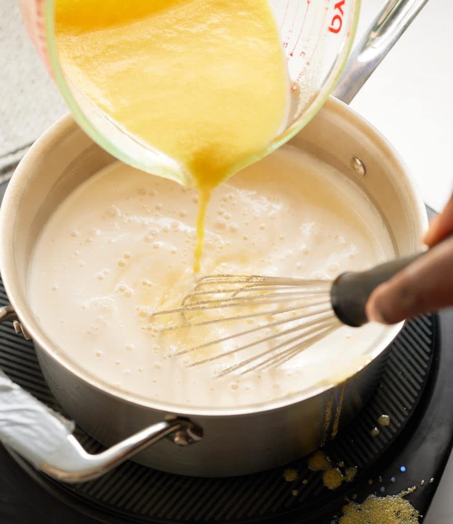 mixture being poured into pot