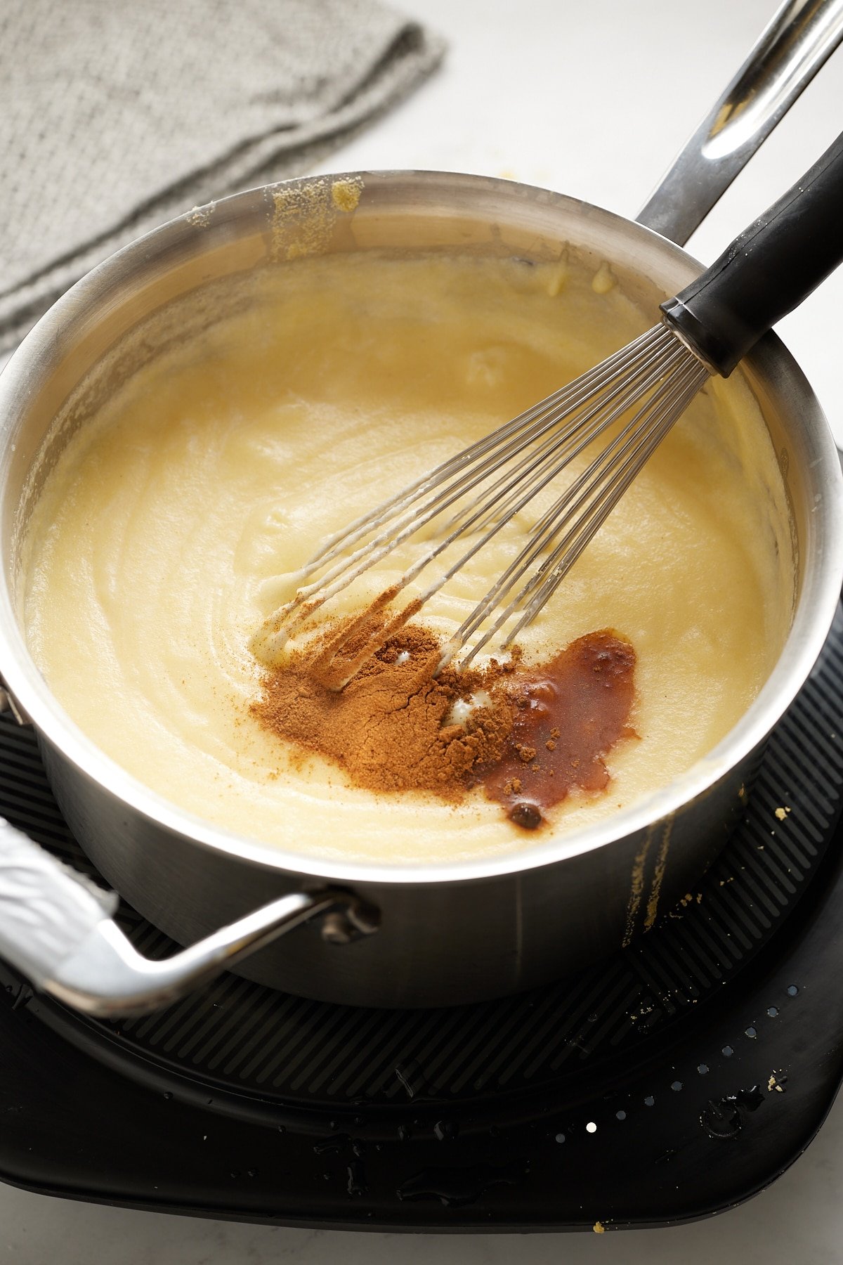 spiced being added to porridge