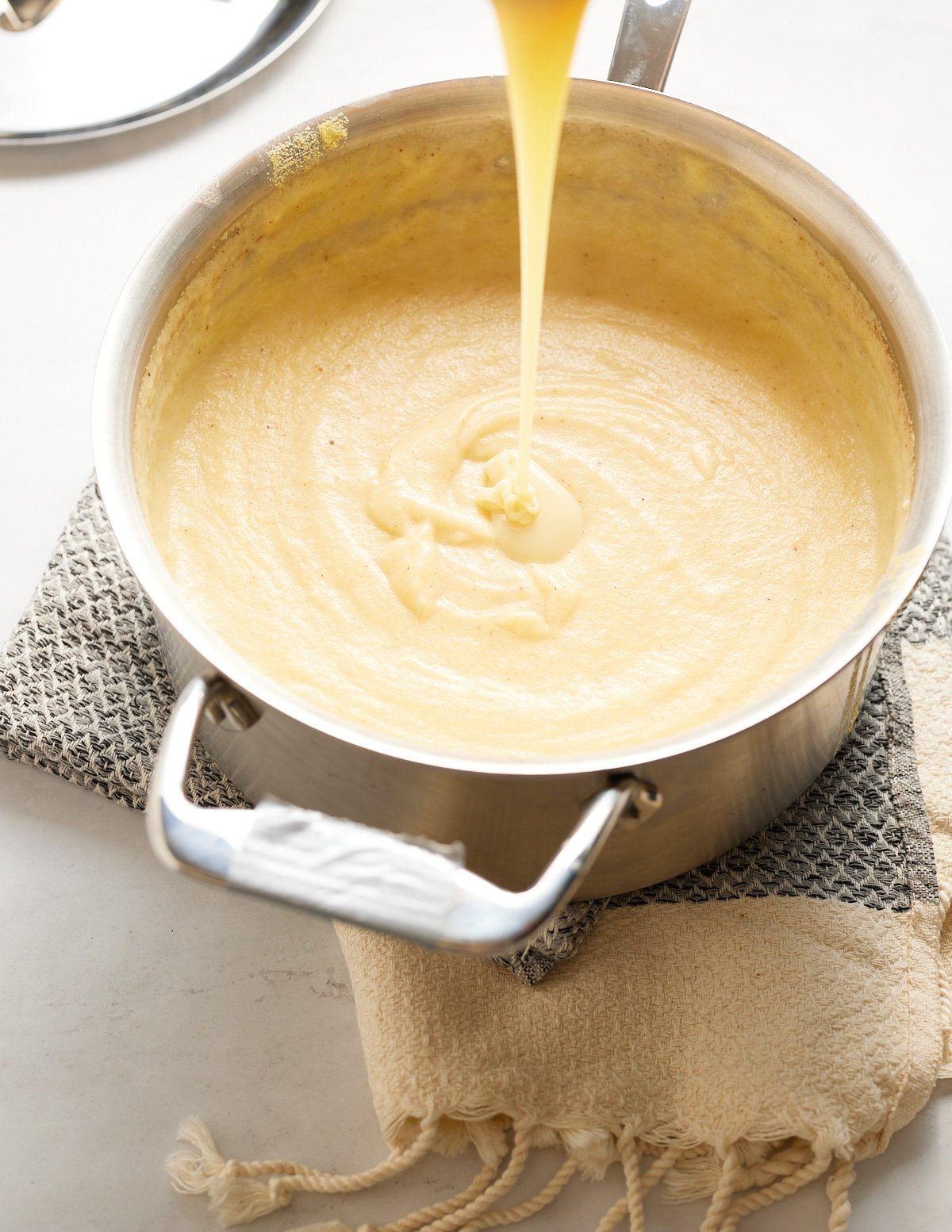 condensed milk being puted into porridge