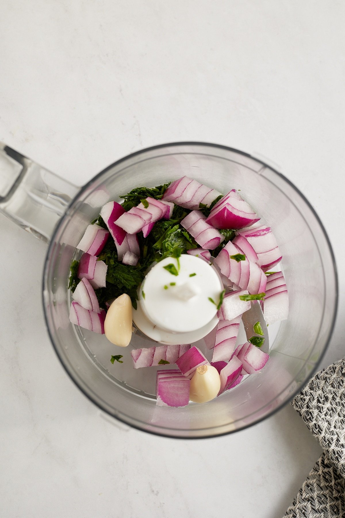 onions and herbs inside mini dicer