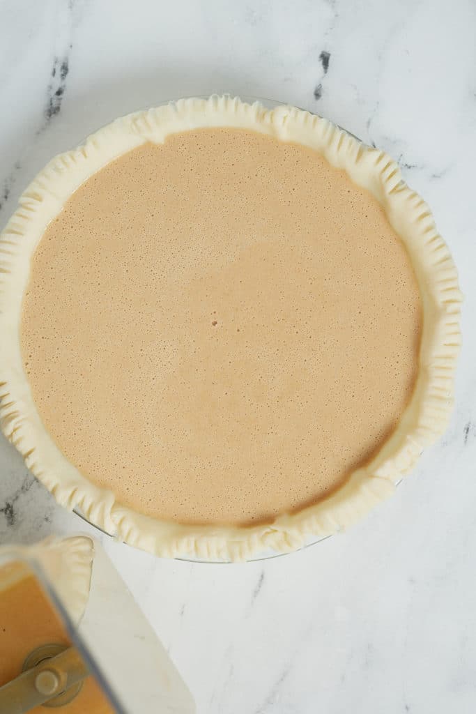 The filling poured into the pie crust.