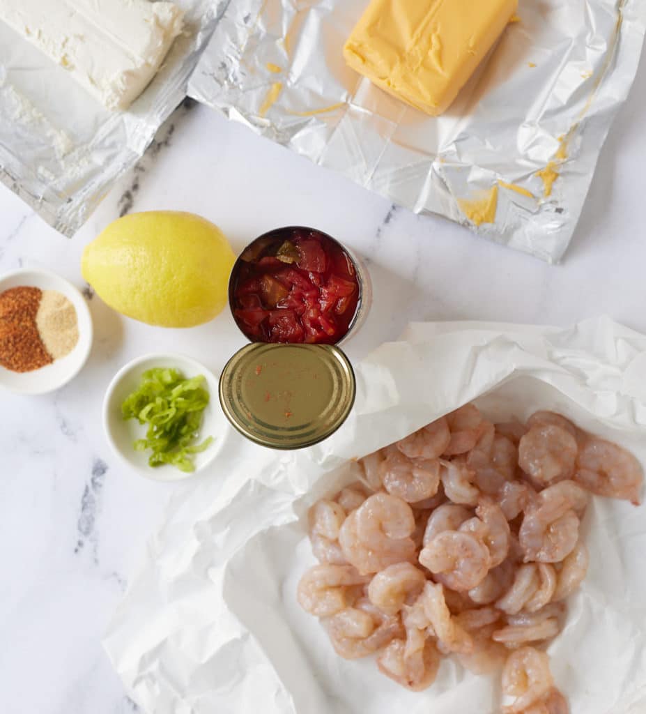 ingredients for hot shrimp dip on marbel background