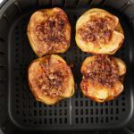 The baked apples in the air fryer basket.