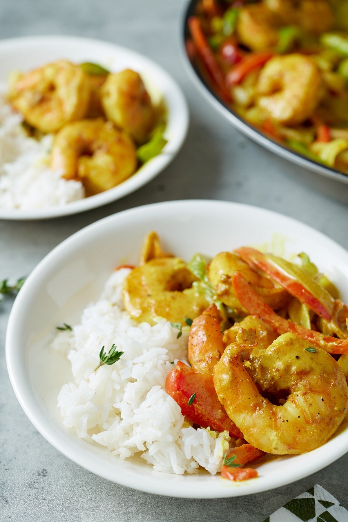 jamaican curry shrimp with rice on white plate