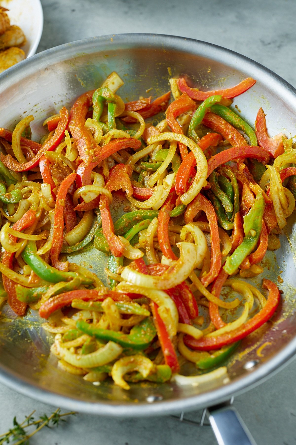 cooked peppers and onions with curry powder added