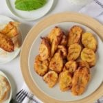 Air fryer plantains served on a white plate.