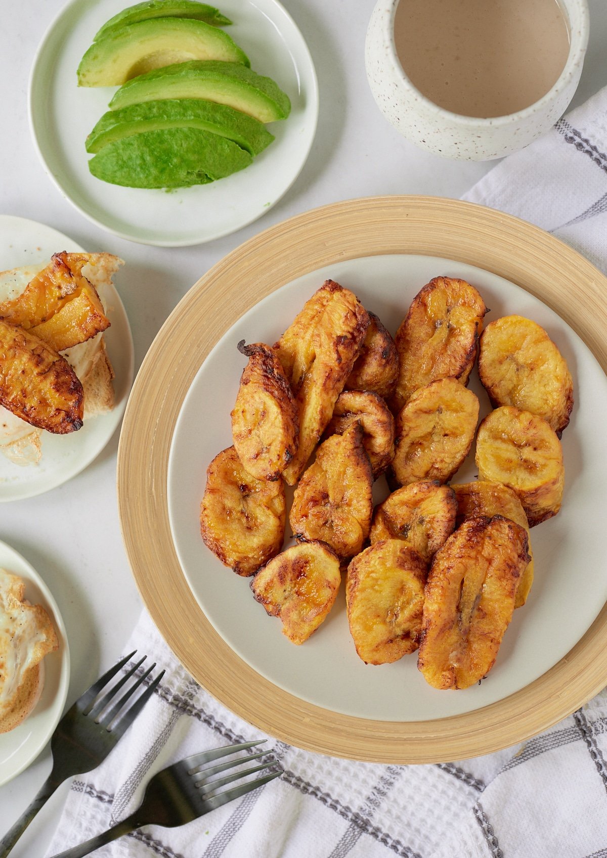 Air fryer plantains served on a white plate.