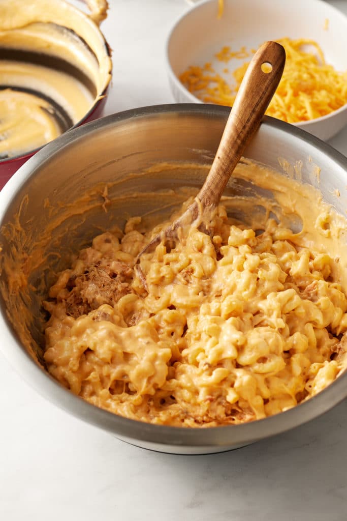 The cheese sauce stirred into the macaroni.