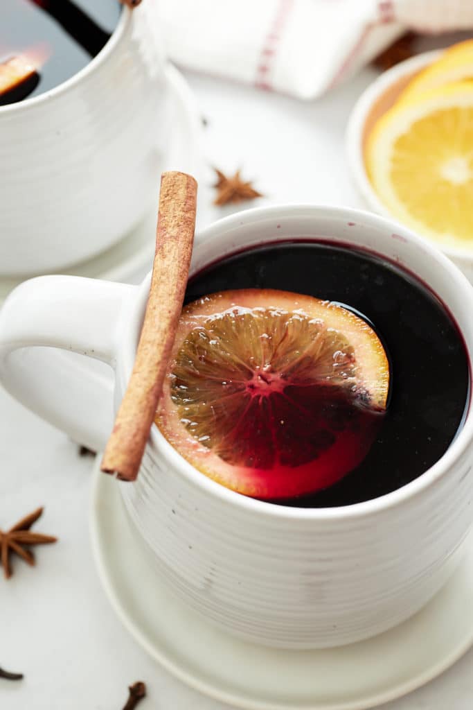 Red mulled wine in a white mug.